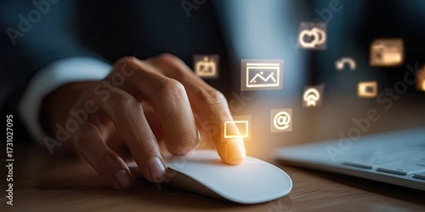 Fototapeta Close-up of person using a computer mouse with glowing digital icons