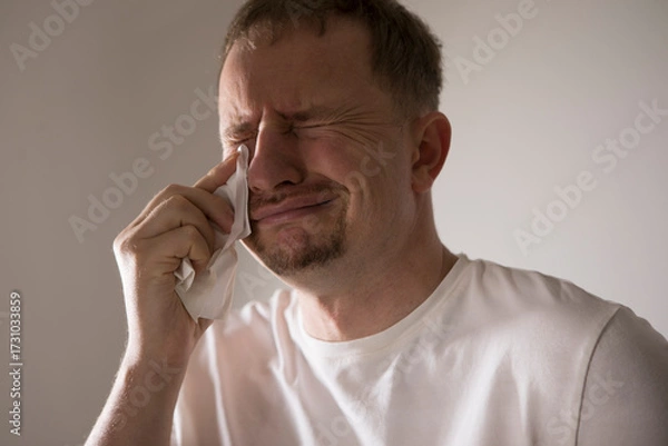 Fototapeta Frustrated guy crying and panicking, holding hands on head and screaming distressed