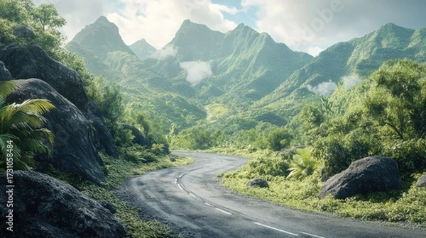 Fototapeta A mountain range with a road that is winding through it