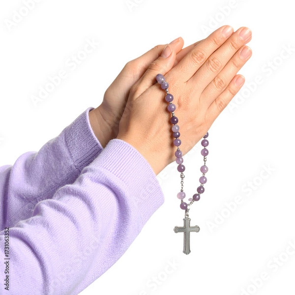 Fototapeta Hands clasped in prayer, holding a rosary with amethyst beads and a silver cross isolated on a transparent background.