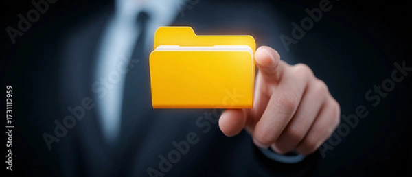 Fototapeta Businessman Activating Or Accessing A Digital Folder Icon On A Virtual Screen. Concept Of Cloud Storage, Data Management, Or File Organization.