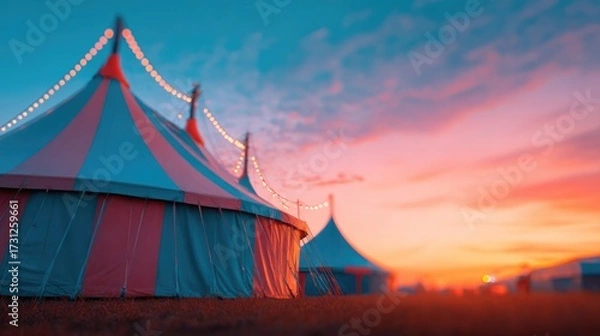 Fototapeta Colorful tents illuminated by sunset glow, creating whimsical at