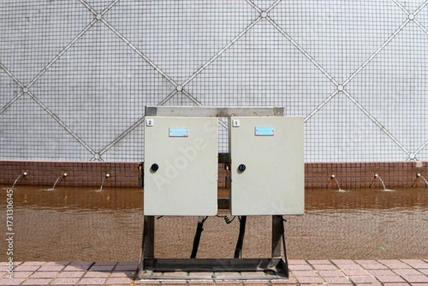 Fototapeta Structure steel equipment distribution electric small. Power button to distribute electricity supply. Temporary electrical control two box outdoor for small business, Main substation. Circuit Breaker.