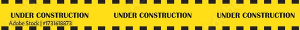 Fototapeta Under construction banner icon. Caution warning tape vector illustration in trendy yellow flat style. Safety barrier stripe design for road work, building site, repair and maintenance graphic.