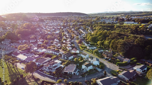 Fototapeta Aerial photo showcasing the entire residential area and townscape of Dalgety Bay, Fife, Scotland. High-angle view perfect for depicting coastal town planning and suburban life.