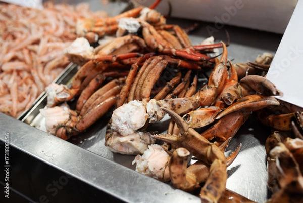 Fototapeta crab cooked in field conditions. Sakhalin crab, tentacles and its parts close-up on a plate. Close-up of sea food, a delicacy.