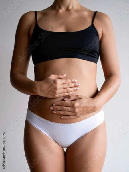 Fototapeta Pregnant woman early stage holding belly health