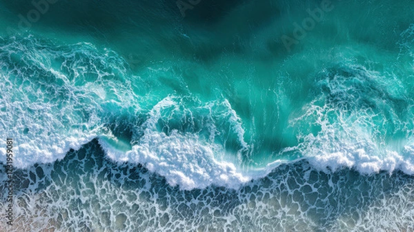 Fototapeta Ocean Wave Cresting: An aerial perspective of the vast, powerful ocean, where turquoise waves crash against the shore, creating a dynamic display of nature's raw energy. 