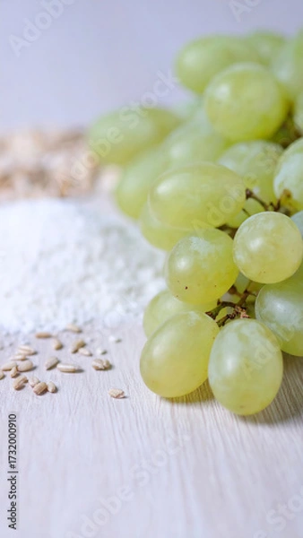 Fototapeta Close up view of ripe green grapes, Background of ripe grapes. oats and grains. 