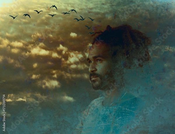Fototapeta Contemplative man among clouds with overlay of flying birds symbolizing loneliness