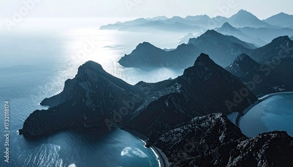 Obraz Misty mountain ranges meet tranquil sea