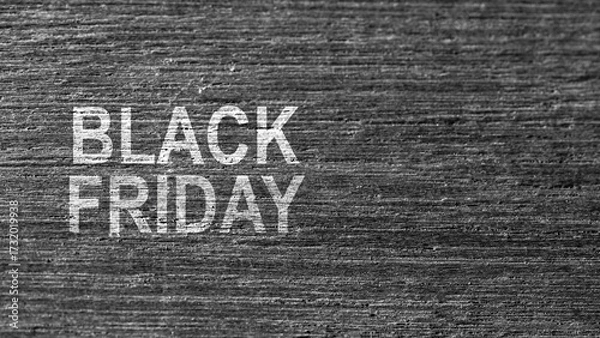 Fototapeta Closeup view of Black Friday text on a wooden background. Copy space. Flat lay. Black Friday sale concept