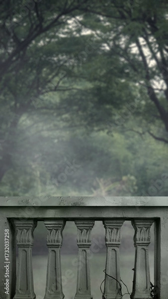Fototapeta Outdoor view of balustrade railing on the balcony overlooking a blurred forest. The scene is scary and mysterious. Dramatic smoke or fog effect. Mockup. Copy Space. Wallpaper or Halloween background