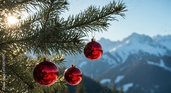 Fototapeta Christmas ornaments hanging on pine tree with snowy mountains in sunlight