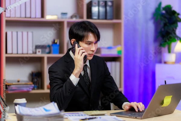 Fototapeta Professional man on a call finalizing a business agreement.