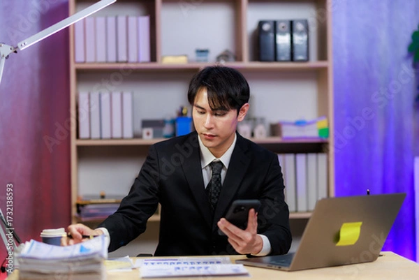 Fototapeta Professional man on a call finalizing a business agreement.