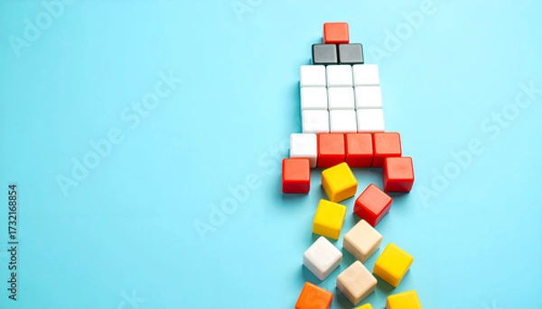 Obraz Colorful cube rocket design on blue backdrop symbolizing innovation, progress, and new beginnings.