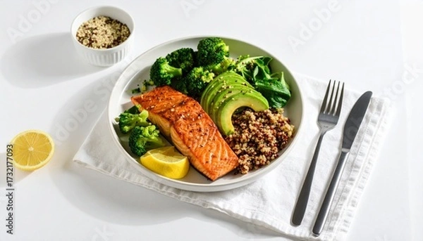 Fototapeta Healthy Salmon Bowl with Quinoa, Avocado, Broccoli, and Lemon