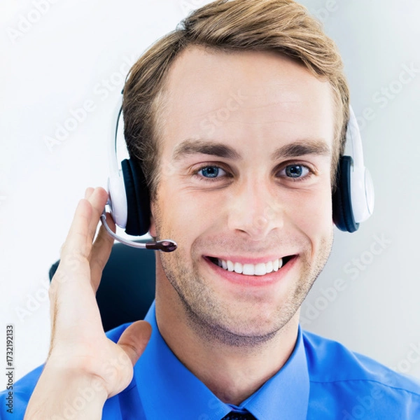 Fototapeta Call Center Service. Face portrait - happy smile customer support callcenter sale agent. Phone operator business man businessman in microphone headset, blue shirt at office workplace. Square image