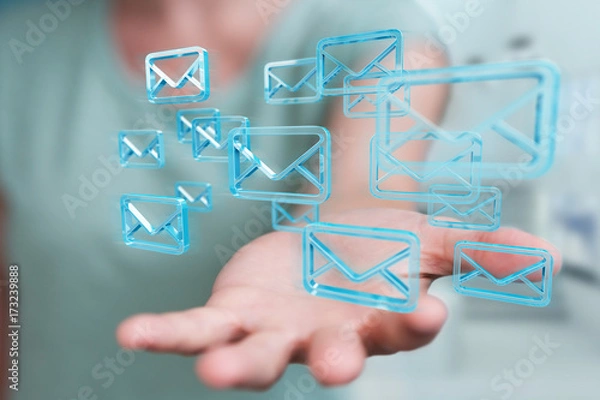 Fototapeta Businesswoman holding and touching floating emails 3D rendering
