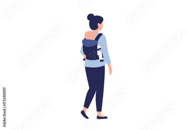 Obraz Woman with bun walks carrying a baby in a dark blue carrier on her back wearing matching pants and shirt