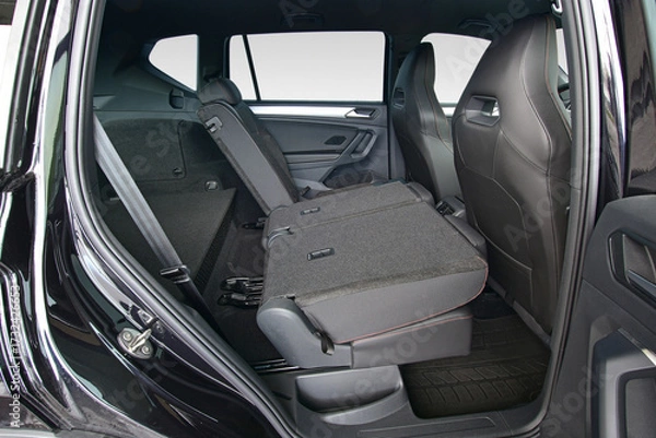 Fototapeta Folded part of the backrest of the rear seats in a passenger car