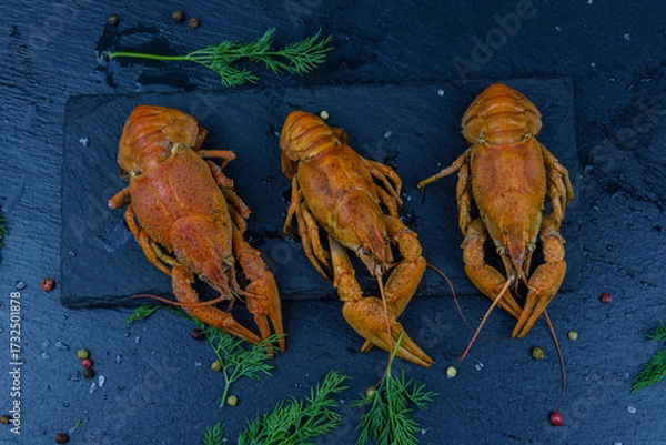 Fototapeta Slate board with the boiled crayfishes and spices. Top view