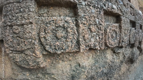 Obraz The Rich Texture and Fine Craftsmanship of Ancient Rock-Cut Reliefs Adorning a Wall in the Kanheri Cave Complex, Evoking Spiritual Heritage.