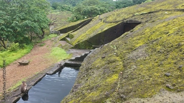 Obraz Engineering of the Ancients: Detailed View of a Carved Water Reservoir Used for Monastic Drinking Supply at the Historic Kanheri Caves Complex, Mumbai, India 