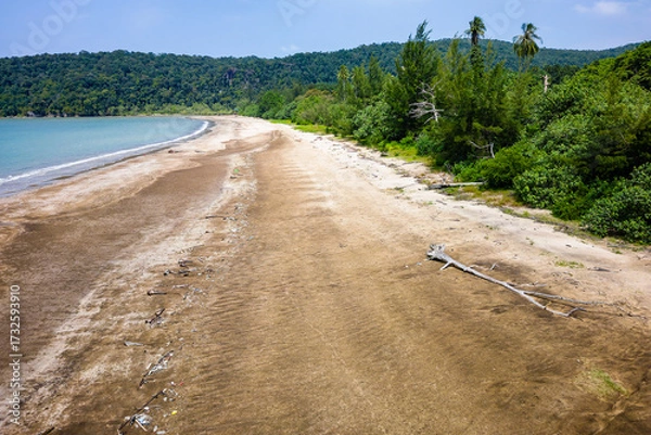 Obraz Aerial drone view of plastic garbage and debris washed ashore on a remote sandy beach