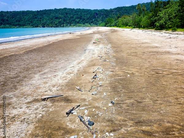 Obraz Aerial drone view of plastic garbage and debris washed ashore on a remote sandy beach
