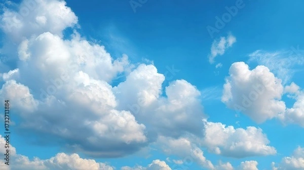 Obraz Bright Blue Sky with White Fluffy Clouds on a Clear Day