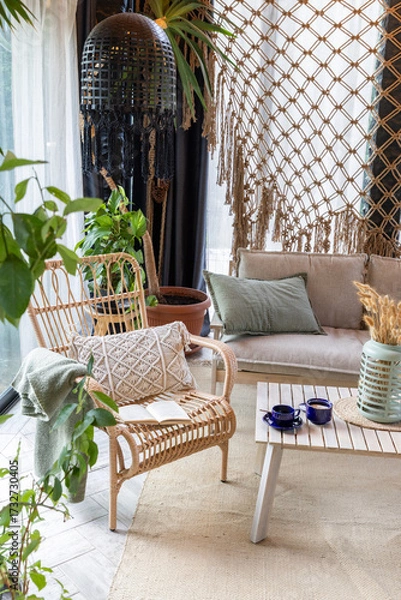 Fototapeta rustic greenhouse reading nook with tropical foliage for concepts of comfort  serenity and eco-friendly interior