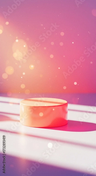Fototapeta A gold product podium on a pink and yellow background with dramatic sunbeam shadows. This warm and vibrant scene is ideal for showcasing summer or cosmetic products.