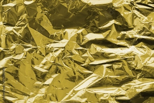 Fototapeta Golden crumpled foil texture on flat surface