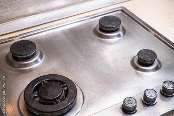 Fototapeta Polished gas cooker after washing. Perfectly clean gas cooker after being washed with polishing chemicals. The result of washing the burners.