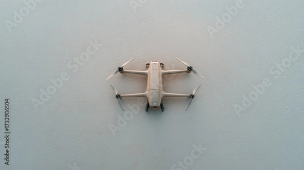 Obraz Drone Flying Above Calm Water Showcasing Advanced Aerial Technology