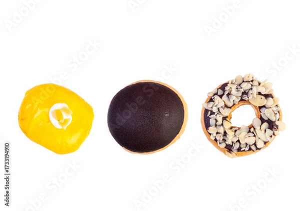 Fototapeta Chocolates donut close-up on a white background. Colorful Chocolate covered donuts with colorful sprinkles.
