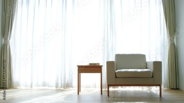 Obraz Elegant minimalist interior with natural light, sheer curtains, neutral armchair, wooden end table, large window,