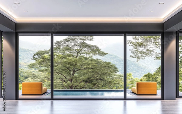 Fototapeta Modern interior design features spacious living area with a view of lush green mountains and a swimming pool