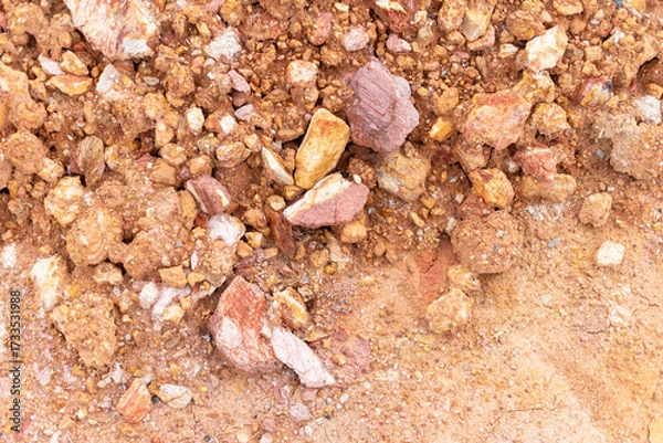 Fototapeta Mining action in a desert location revealing rich mineral content in natural environment
