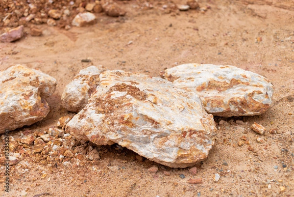 Fototapeta Mining operation revealing raw minerals quarry site natural resource dry environment ground level exploration