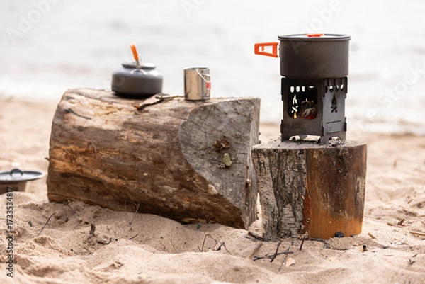 Obraz Cooking in nature using firewood and fire