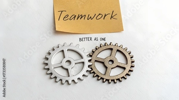 Fototapeta Two gears representing teamwork and the concept of cooperation