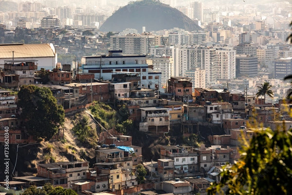Fototapeta Dense housing on a steep hillside in a favela community of Santa Teresa in Rio de Janeiro, Brazil, showcasing colorful, tightly packed homes.