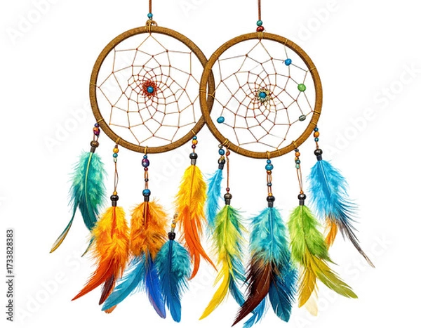 Fototapeta Two ornate dreamcatchers with colorful feathers hang against a stark black backdrop