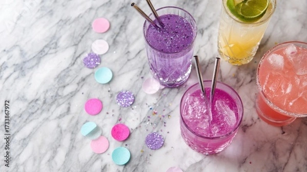 Fototapeta Vibrant Refreshing Cocktails on a Marble Surface with Colorful Sprinkles and Straws, Perfect for Summer Gatherings and Celebrations