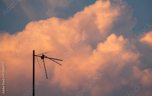 Fototapeta Antenna with a beautiful sunset sky background at dusk
