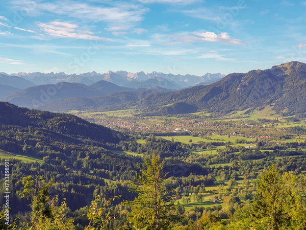 Obraz View on the Bavarian town of Lenggries with surrounding mountain landscape and the Alps in the background on a sunny morning