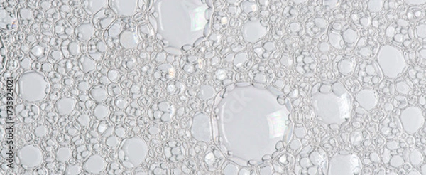 Fototapeta The texture of the foam of shower gel or soap suds. Macrophotography